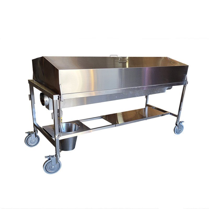 A modern and sanitary autopsy suite featuring integrated stainless steel equipment, including an autopsy table, casework, and a ventilated workstation.